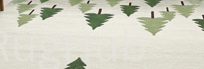 May include: A cream-colored rug with a repeating pattern of stylized green and light green fir trees with brown trunks. The trees are evenly spaced across the rug's surface, creating a forest-like design. The rug has a textured appearance.