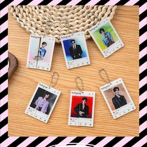 May include: Six rectangular acrylic keychains featuring printed Instagram-style post frames. Each keychain displays a portrait of a person in various outfits, including suits and casual wear, with a silver ball chain attached to the top of each piece.