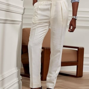 Pantaloni plissettati in lino bianco: pantaloni sartoriali a vita alta