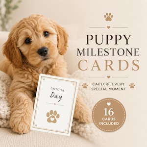 以下が含まれることがあります： ゴールデンレトリバーの子犬が、「GOTCHA Day」と書かれたカードを持っています。カードにはハートの足跡があります。画像には「PUPPY MILESTONE CARDS」と「16 CARDS INCLUDED」というテキストも含まれています。