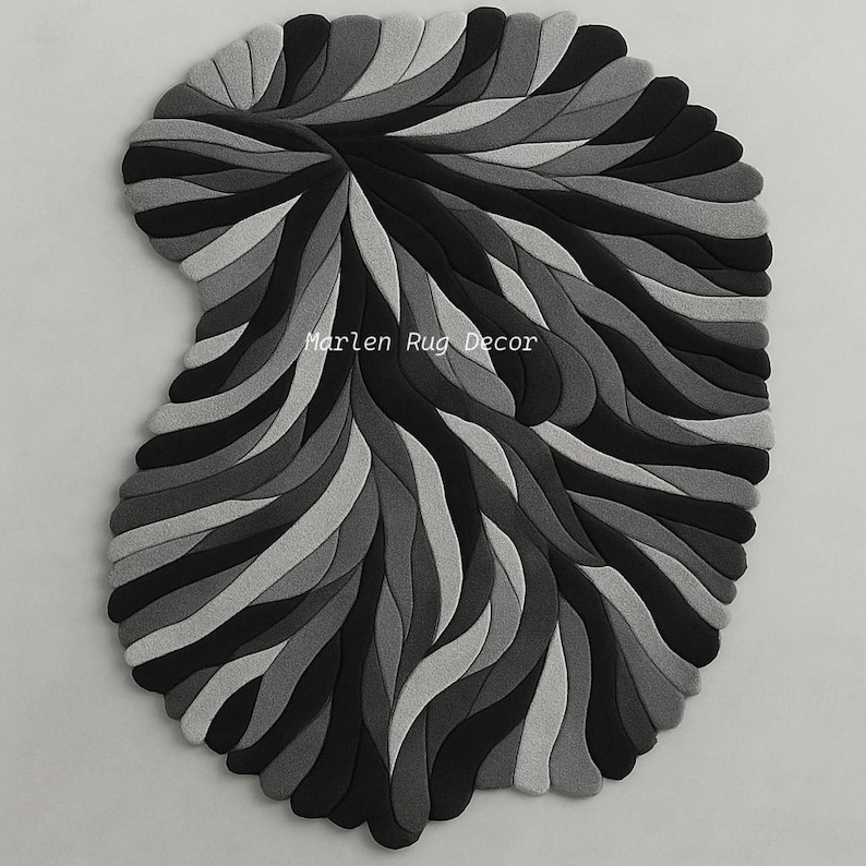 May include: A decorative rug with a unique, abstract design. The rug features a pattern of layered, curved shapes in shades of gray and black. The text "Marlen Rug Decor" is visible on the rug.
