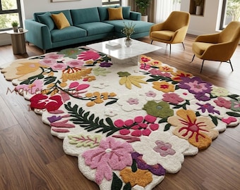 May include: A rectangular area rug with an off-white background featuring a vibrant, multi-colored floral pattern. The design includes large, tufted flowers in shades of pink, yellow, red, purple, and green, with organic, scalloped edges.