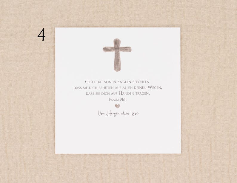 May include: A white card with a watercolor-style cross at the top. Below the cross is text in German, including Psalm 91:11. The card also includes the phrase "Von Herzen alles Liebe" and a small heart symbol.