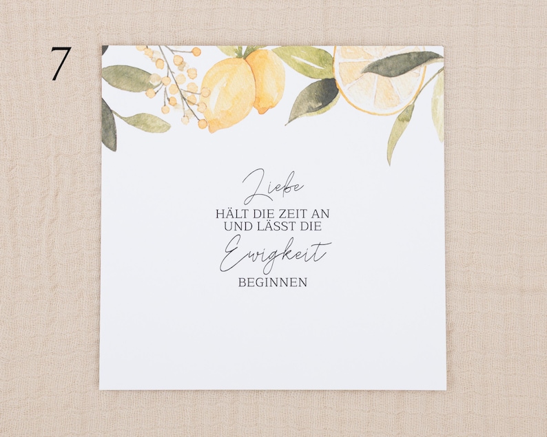 May include: A square white card featuring a watercolor illustration of yellow lemons and green leaves along the top edge. The text reads: Liebe H&Auml;LT DIE ZEIT AN UND L&Auml;SST DIE Ewigkeit BEGINNEN. The design is centered on a clean, plain white background.
