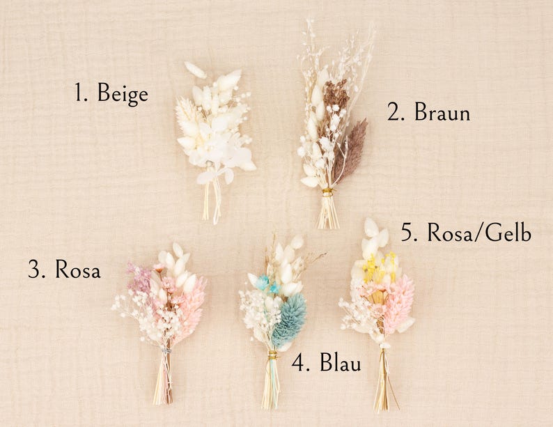 May include: Five small dried flower bouquets in beige, brown, pink, blue, and pink/yellow. Each bouquet is tied with natural twine. The bouquets are arranged on a neutral background, with the color names labeled.