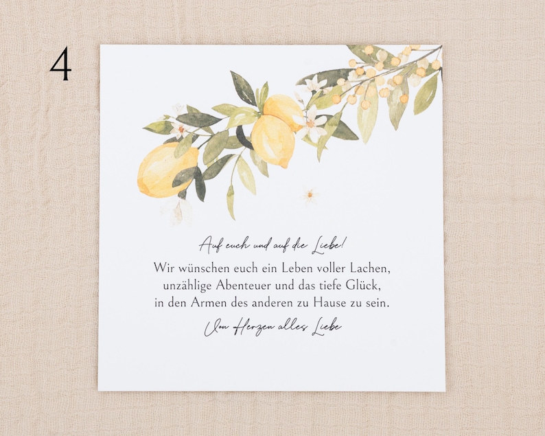 May include: A square greeting card featuring a watercolor illustration of yellow lemons, green leaves, and small white flowers at the top. The text reads: Auf euch und auf die Liebe! Wir w&uuml;nschen euch ein Leben voller Lachen, unz&auml;hlige Abenteuer und das tiefe Gl&uuml;ck, in den Armen des anderen zu Hause zu sein. Im Herzen alles Liebe.