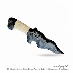 May include: A 10-inch obsidian dagger with a unique design. The black obsidian blade is intricately shaped, and the handle is wrapped with natural-colored thread. The text "Forestofcrystals" is visible.