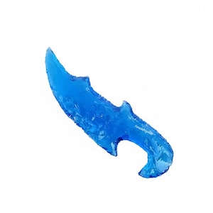 May include: A white ceramic mug with a black handle and the text "But First, Coffee" in a bold, black font. The mug is set against a blurred background, highlighting its clean design.