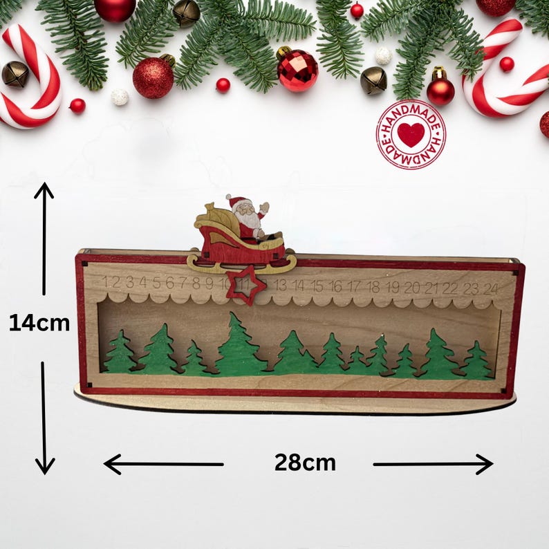 May include: A wooden Christmas advent calendar featuring a sliding Santa in a red sleigh, a row of green trees, and numbers 1 through 24. The rectangular structure measures 14 cm in height and 28 cm in width, with a red star marker.