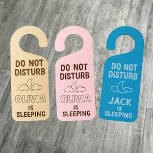 Personalised Baby Sleeping Door Hanger – Do Not Disturb Nursery Sign – Custom Name Door Tag – Laser Engraved in Wood, Pink or Blue