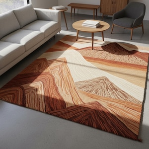 May include: A rectangular area rug with a mountain landscape design. The rug features shades of brown, beige, and white, creating a textured, layered effect. The design evokes a desert or canyon scene, with a mix of geometric and organic shapes.