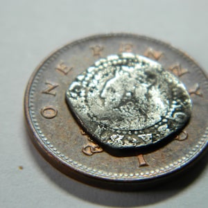 Tiny Queen Elizabeth 1st hammered silver coin dating from 16th century Metal detecting detector find a great authentic Tudor gift / present