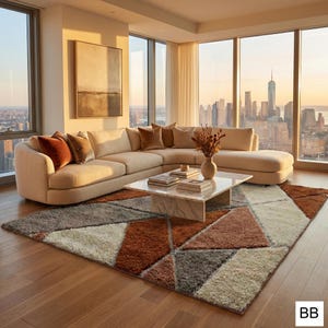 May include: A modern living room with a beige sectional sofa, a marble coffee table, and a geometric patterned rug in shades of brown, gray, and cream. Large windows offer a city skyline view.