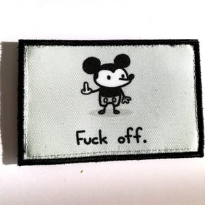 May include: A rectangular patch with a black border and a light blue background. The patch features a cartoon mouse giving the middle finger, with the words "Fuck off." printed below the mouse.