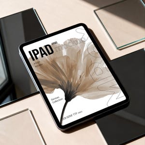 May include: An iPad mockup featuring a floral design on the screen. The screen displays the words "IPAD mockup" and "Devices Collection". The tablet is surrounded by reflective black and clear glass squares, set against a neutral background.