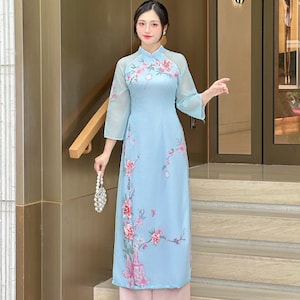 Ngoc Binh Ao Dai | Elegant Blue Modern Vietnamese Dress for Women with Floral and Crystal Embellishments | Includes Pants B9