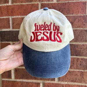 Retro &quot;Fueled by Jesus&quot; Baseball Cap – Cream & Denim Blue Hat with Red Embroidery, Cotton Dad Hat, Christian Vintage Aesthetic Gift
