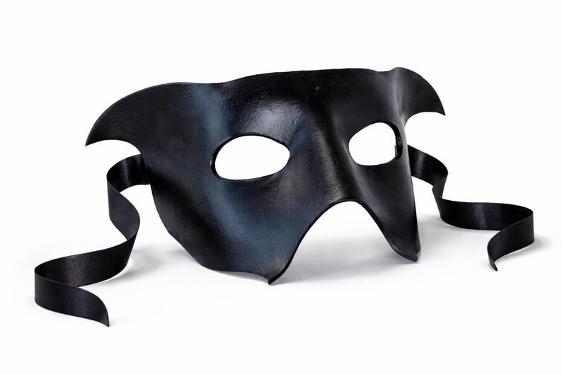 handmade black leather masquerade mask with ribbon ties shown in a clean 3/4 view on a white background