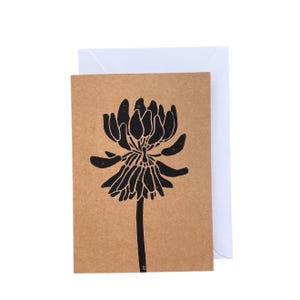 Tarjeta plegable en linóleo con forma de flor