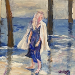 May include: An oil painting depicts a person in a blue dress and white shawl standing in water. The artwork uses shades of blue, white, and beige to create a serene coastal scene. The painting has a textured, impressionistic style.
