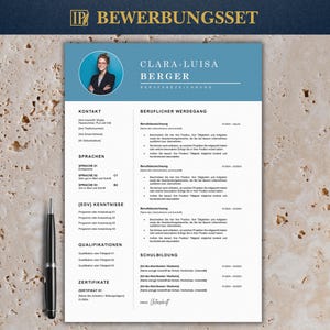May include: A professional CV template with a blue and white design. The CV includes sections for contact details, work experience, skills, and education. The name "Clara-Luisa Berger" is at the top. A pen is placed on the left side of the CV.