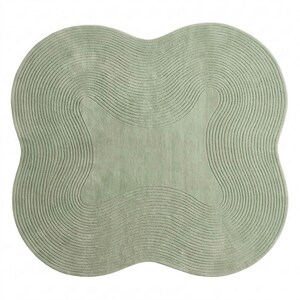 May include: A sage green area rug with a distinct four-lobed, clover-like shape. The surface features a series of concentric, wavy, carved lines that follow the outer contour of the rug, creating a textured, rippled effect across the entire piece.
