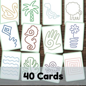 May include: A set of 40 white rectangular cards featuring various colored line art illustrations including a swan, palm tree, dinosaur, lion, kite, seahorse, hand, flower, wavy lines, leaf, octopus, and a square spiral pattern on each card.
