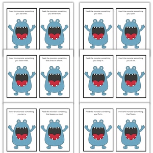 May include: A set of eight cards with a blue monster illustration and text prompts. Each card features a cartoon monster with a large red mouth and the phrase "Feed the monster something" followed by a different action or object, such as "you eat with" or "you sleep in."