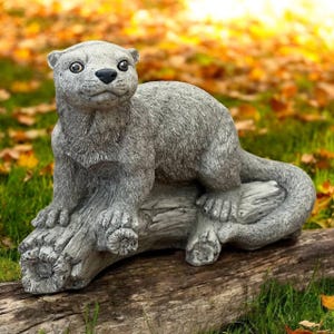 Otter sitting on limb figure Wild animal statue for garden or patio Detailed otter statuary Concrete sculpture Lawn animals lovers gift