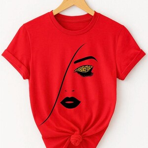 Trendy Graphic T-Shirt – Abstract Woman Face with Leopard Eye Print – Fashion Tee for Women – Chic Art Design Top”