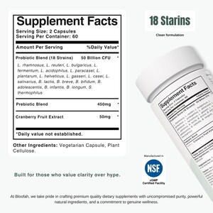 May include: A white ceramic mug with a black handle and the text "But First, Coffee" in a bold, black font. The mug is set against a blurred background, suggesting a cosy setting.