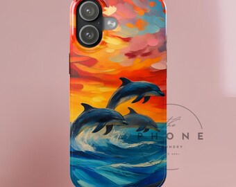 May include: A phone case featuring a vibrant painting of three dolphins leaping from blue waves against a sunset sky of orange, yellow, and pink hues. The case has a glossy finish and a camera cutout.