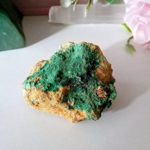 May include: A set of three ceramic mugs with a speckled, matte finish. The mugs are in shades of cream, light gray, and dark gray. Each mug has a simple, minimalist design, perfect for coffee or tea.