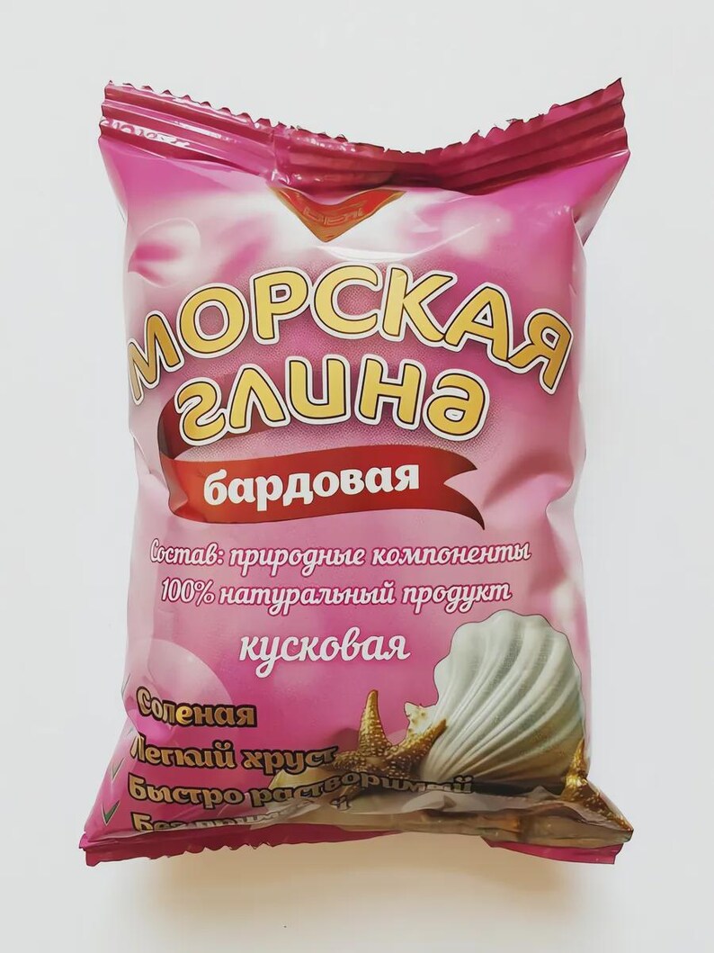 May include: A pink package with the words "МОРСКАЯ глина" in gold lettering. The package also features a seashell and starfish graphic. Text on the package includes "Состав: природные компоненты" and "100% натуральный продукт".