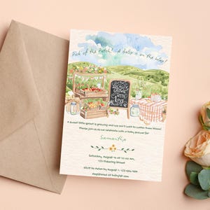 May include: Watercolor baby shower invitation with a farm theme. The invitation features a farmers market scene with the text "Pick of the Patch! A Baby is on the Way!" and "Locally Grown With Love". Includes event details.