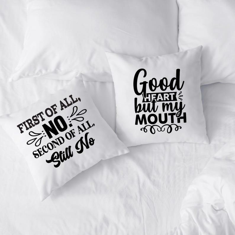 May include: Two white throw pillows with black text. One pillow reads "FIRST OF ALL, NO, SECOND OF ALL, Still No." The other pillow says "Good HEART but my MOUTH."