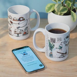 May include: Two white ceramic mugs featuring colorful illustrations of Rube Goldberg-style machines and diagrams. One mug displays a QR code with the text Scan to Simplify your life. A smartphone screen shows a Daily Life Hacks app interface.