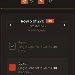 May include: A digital interface displaying crochet pattern instructions for Row 5 of 270, featuring 192 stitches. The screen shows 42 single crochet stitches in Onyx color 003 and 38 single crochet stitches in Paprika color 001 with text.