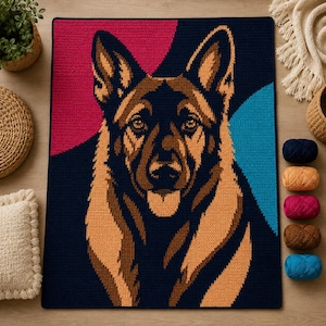 May include: A rectangular crochet blanket featuring a detailed portrait of a German Shepherd dog. The dog is rendered in shades of brown, tan, and black against a background of dark blue, with a vibrant pink section and a bright blue curved accent.