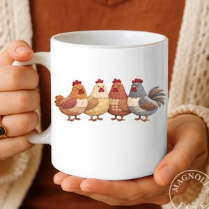 May include: A white ceramic mug with a black handle and the text "But First, Coffee" in a bold, black font. The mug is on a wooden surface. The mug appears to hold approximately 350 ml.