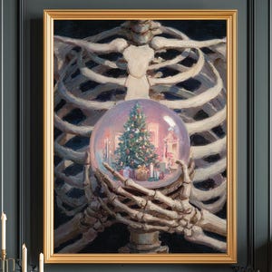 May include: A framed artwork depicts a skeleton holding a snow globe with a Christmas tree and city scene. The artwork has a gold frame and is displayed on a dark teal wall above a wooden cabinet. A gold lamp and candle holders are also visible.