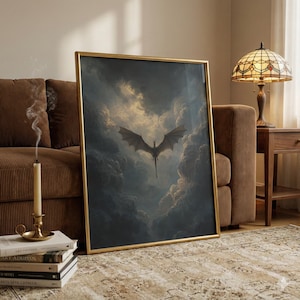 May include: A framed art print depicting a dragon in flight amidst a dramatic, cloudy sky. The dragon is dark, with outstretched wings, set against swirling grey and gold clouds. The frame is gold.