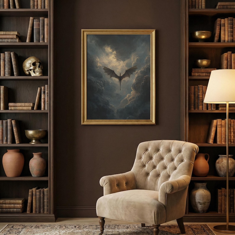May include: A framed picture shows a dragon flying in a cloudy sky. The dragon is dark with spread wings. The artwork is in a gold frame, hung on a brown wall. A beige armchair is below the artwork, with bookshelves on either side.