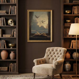 May include: A framed painting depicts dragons flying over a seascape with an open book on a windowsill. The painting is in a gold frame and hangs above a button-tufted armchair. Bookshelves filled with books and decorative items flank the painting.