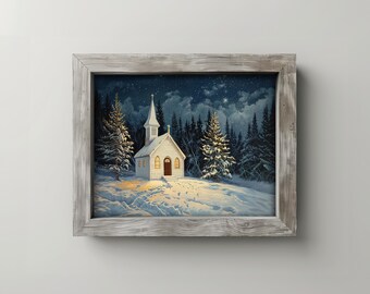 May include: A framed painting depicts a snow-covered landscape with a white church illuminated by warm light. The church has a steeple and is surrounded by evergreen trees under a starry night sky. The frame is a light gray color.