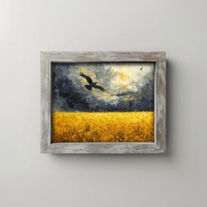 May include: An oil painting in a rustic wooden frame depicts a field of golden wheat under a stormy sky. A dark bird soars across the canvas, adding a sense of movement to the landscape. The artwork evokes a feeling of nature and the outdoors.