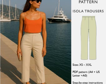 Puede incluir: Una mujer con un top naranja y pantalones beige posa cerca del agua. La imagen incluye un patrón de costura PDF para pantalones Isola, tallas XS-XXL, instrucciones paso a paso y una guía de telas.