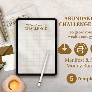 May include: An Abundance Challenge Kit with a tablet displaying a 100 envelopes challenge. Includes pens, envelopes, and a candle. The text reads "Manifest & Save Money Bundle" and "5 Templets".