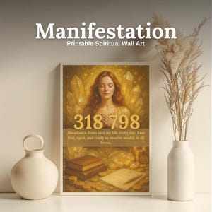 May include: A framed print with the word "Manifestation" at the top. The image features a woman with red hair, surrounded by crystals, and the numbers "318 798". The text reads "Abundance flows into my life every day. I am free, open, and ready to receive wealth in all forms."