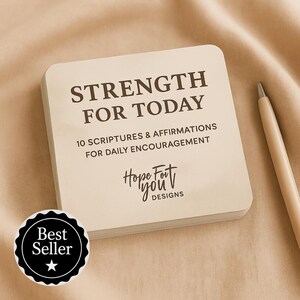 May include: A stack of square cards with the text "STRENGTH FOR TODAY" and "10 SCRIPTURES & AFFIRMATIONS FOR DAILY ENCOURAGEMENT". The cards also feature the "Hope For You Designs" logo and a "Best Seller" sticker. A pen rests on the side.